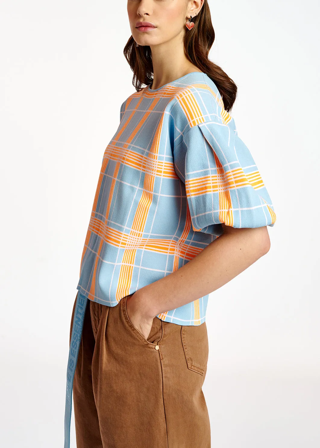 Light blue puffed sleeve knitted top with check motif